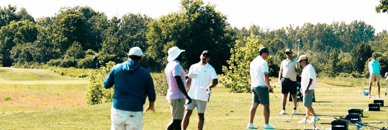 Golfers taking a lesson on the practice range at FireRock