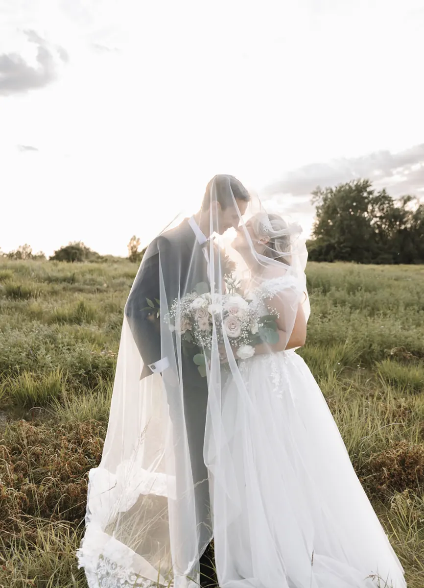 Newlyweds embracing on the FireRock grounds